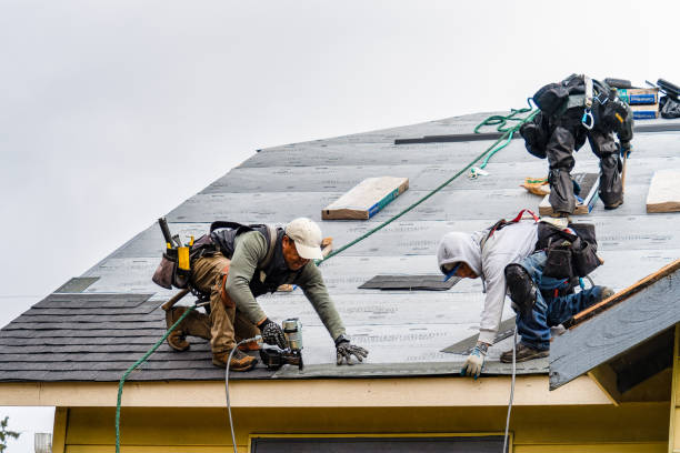Professional Gutter Installation technician working in Fall River, MA